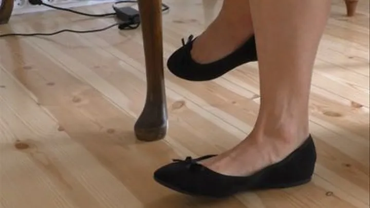 Foot Tapping in Black Ballet Flats