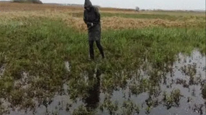 Woman in boots in the swamp