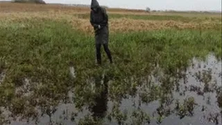 Woman in boots in the swamp