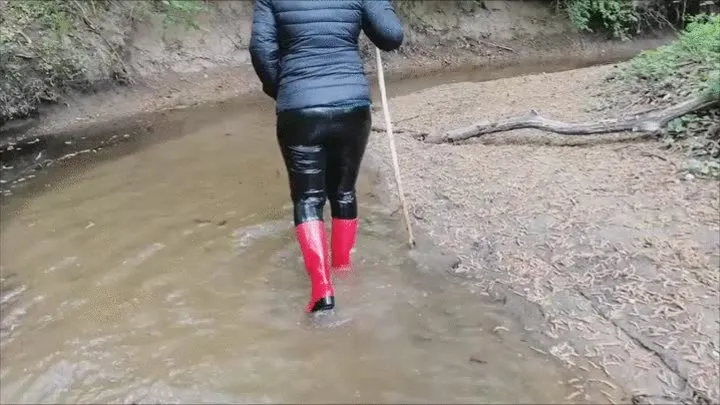 Red rubber boots under water