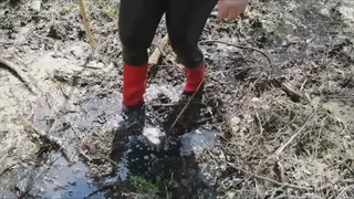 Red rain boots, swamp and forest