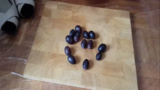 Crushing grapes with High Heels and long red toenails