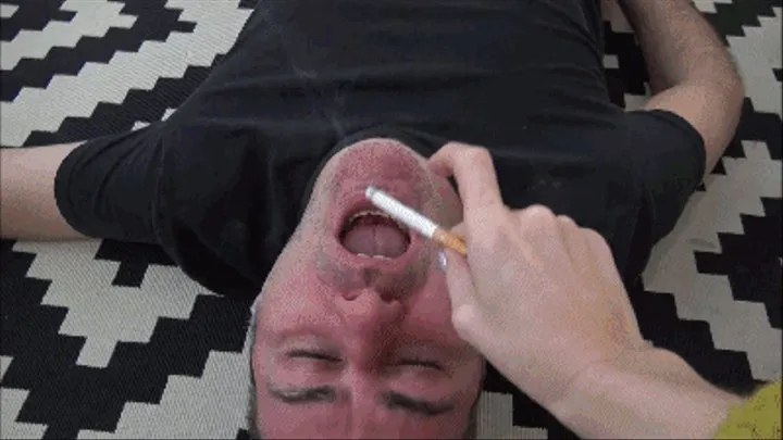 Multitaskig slave: Mouth as an ashtray and face as a footstool