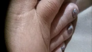 Extreme close up toenail cheese removal