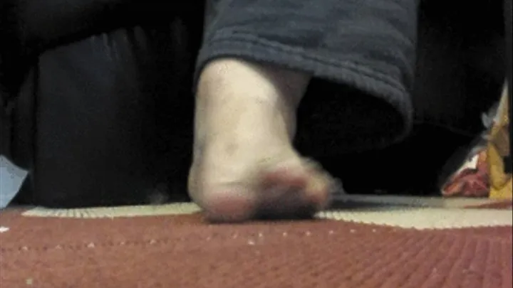 Show off soles then slap foot and grind against carpet