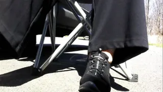 toes flexed rubbing soles on blacktop