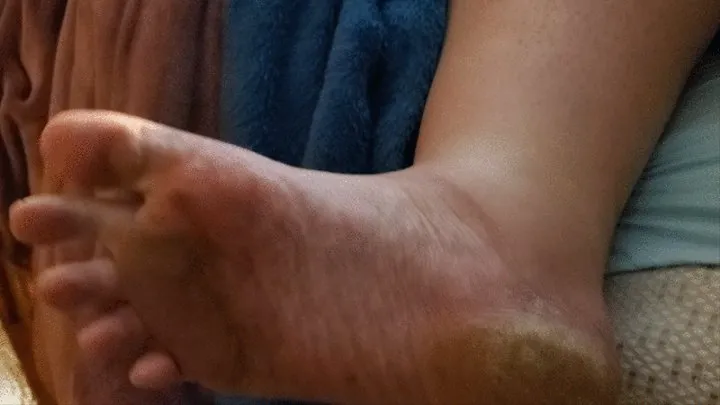 Wiggling toes with dirty soles