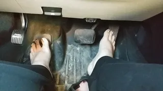 Driving barefoot with gold toenails