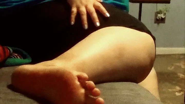 Lounging on couch soles in view