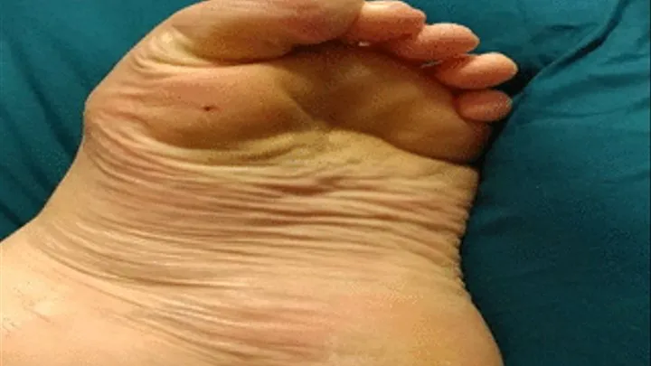 Closeup of wrinkly sole as toes clamp