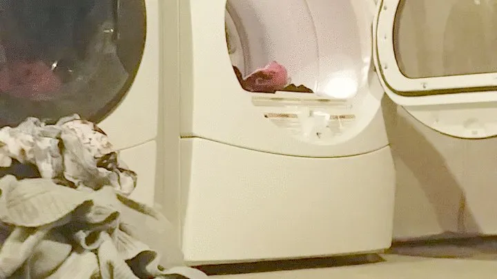 Barefoot voyeur folding laundry