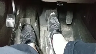 Sneakers rubbing snow off pedals
