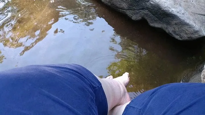 Kicking water at the waterfall