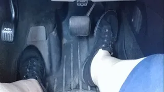 Slipping stinky sneakers off to drive