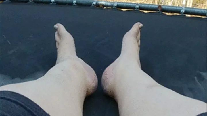 Posing feet on trampoline