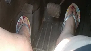 Driving with Pink polish and pastel flipflops