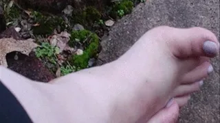 Crossed ankle foot rub in nature