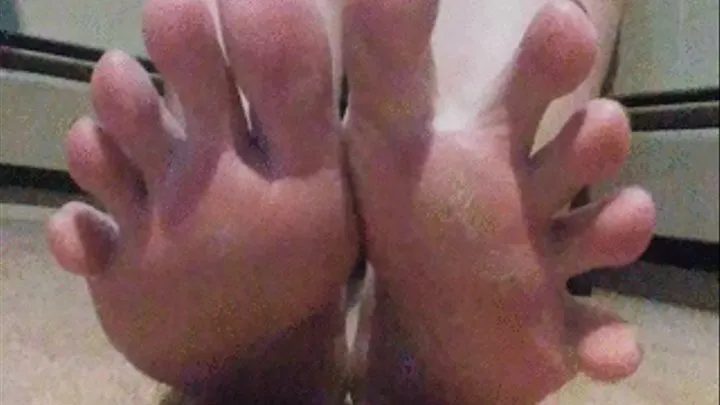 Close up toes clasping and wiggling