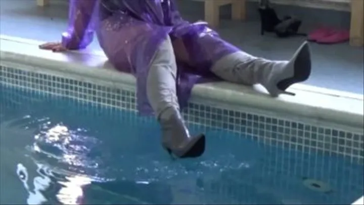 In the pool with boots and plastic raincoat