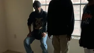 African guy gets a hard hand spanking while his legs are being held down