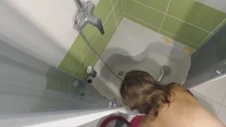 Shower in shower cab with hair washing