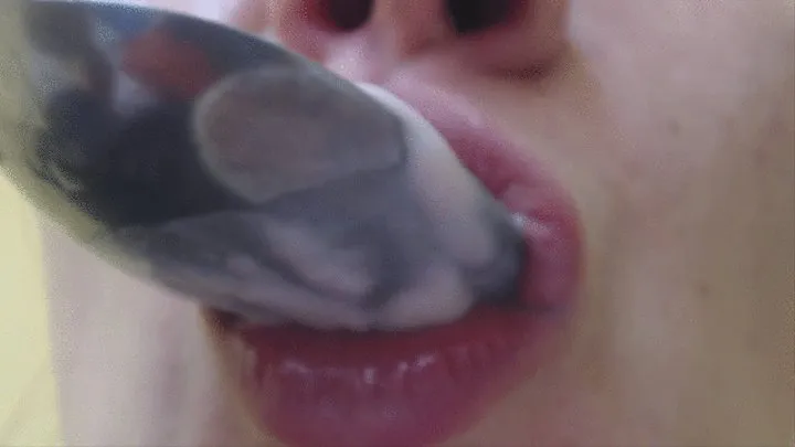 3 minutes eating yoghurt by spoon in big close up