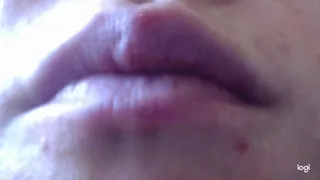 I am putting lipstick on my lips in xtreme close-ups