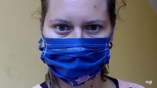 Nice cotton blue mask covering nose and mouth to cam