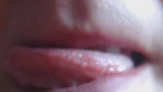 Licking lip to cam in close up