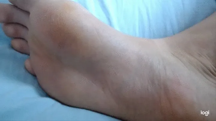 My barefoot with wrinkes in close up to cam no sound