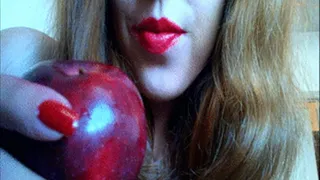 Redhead Sucking on and Biting an Apple