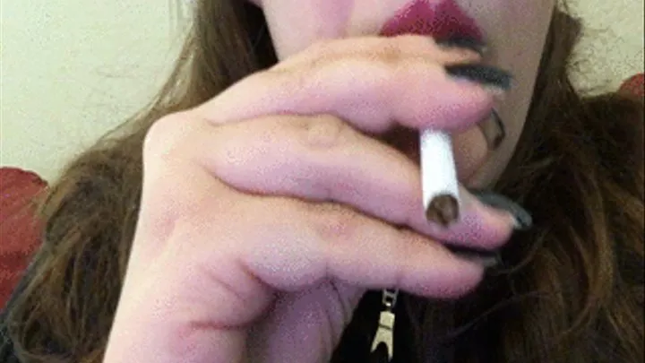 Goth Girl with Dark Red Lips and Black Fingernails Smoking a Cigarette