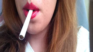 Sexy Redhead with Red Lips Smoking Cigarette