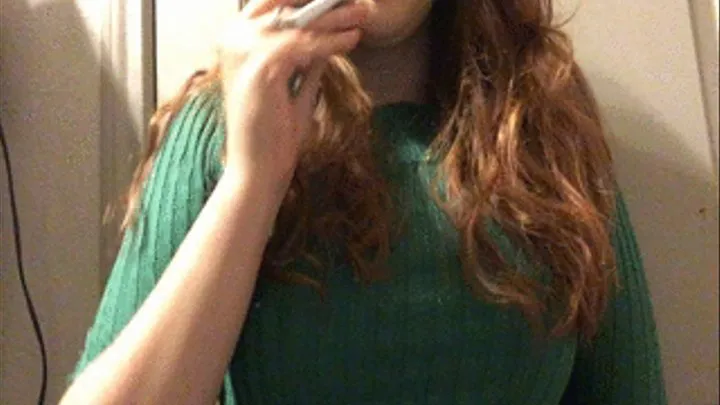 Pale Redhead with Big Tits Smoking in a Green Sweater