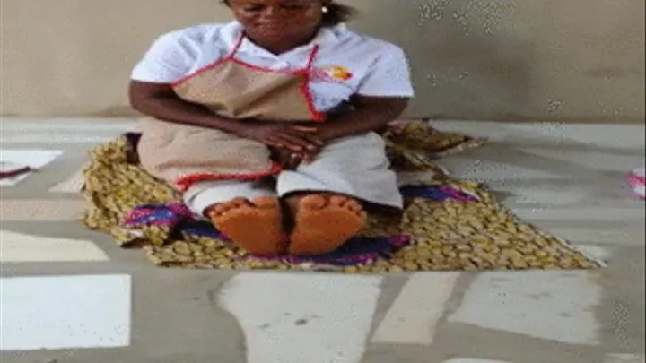 Mango Seller Sits On Floor and Crosses Soles