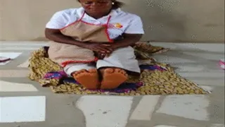 Mango Seller Sits On Floor and Crosses Soles