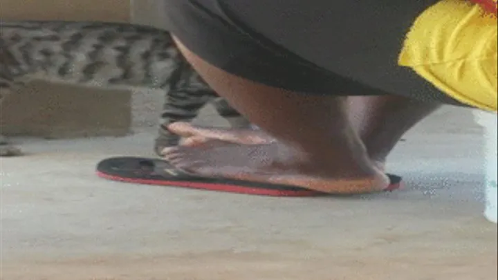 Mango Seller Eating Lunch with Thick Ebony Feet Shown