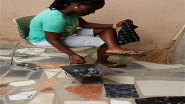 Baaba the Hairstylist Prepares to Cook in Her Colorful Flip Flops