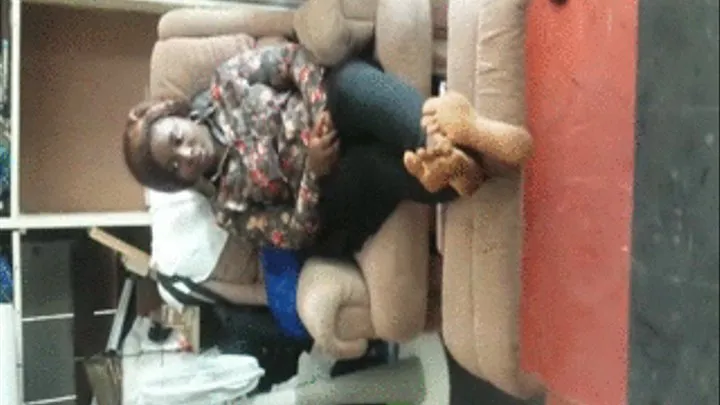 Brong Ahafo, Kumasi GH Chick Sits on Lazy Boy Chair with Soles Crossed