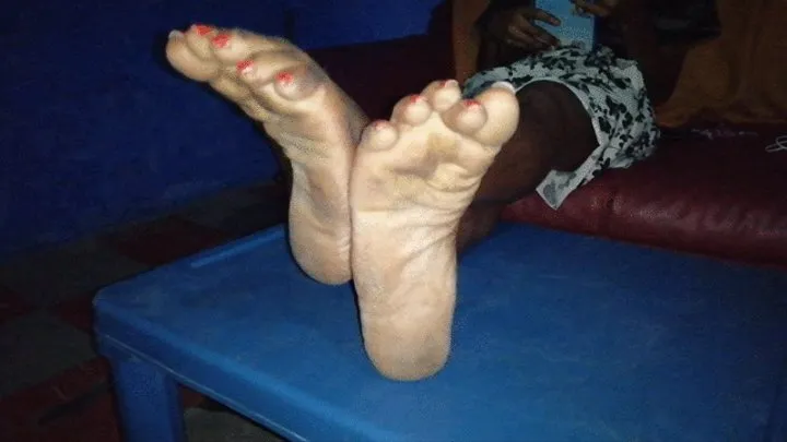 Lynna's Dirty, Wrinkly Soles Crossed at Ankles