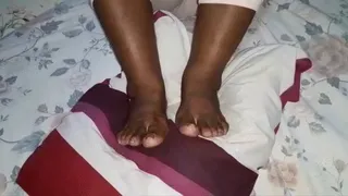 Auntie T Shows Off Soles Under Feet by Raising Feet & Soles Side to Side