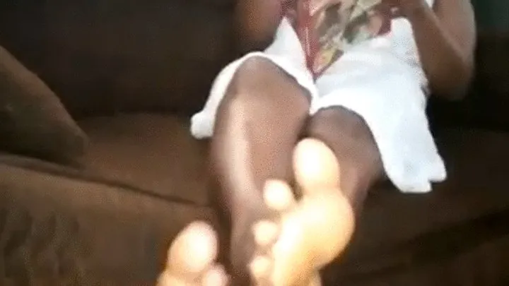 Akweley Reading a Book with Wrinkled Soles Crossed & Rubbing