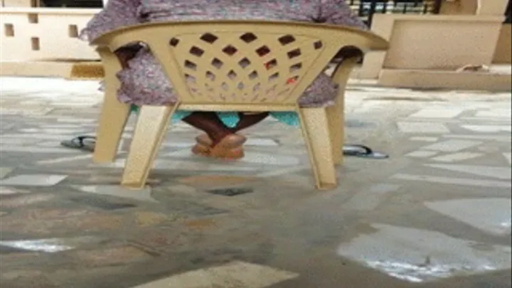 Mango Seller Sitting Down With Ebony Soles From Behind