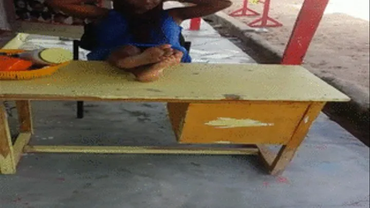 Baaba Hairstylist Reads & Crosses Wrinkly Soles On Table