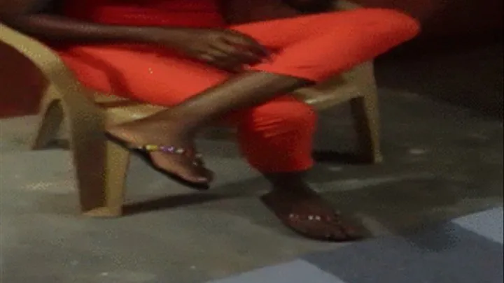 Slim GH Obaa Dangles Slipper (Flip flop) with Leg Crossed Over Other