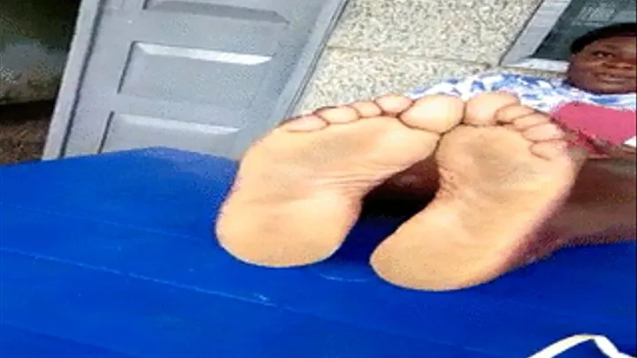 Ghana Fan Choco Obaa's Meaty, Thick Soles On Table Side by Side