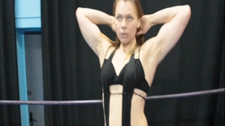 Fem.bodybuilder flexes muscles