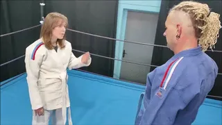 Girl in white gi vs guy in blue gi