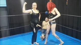 Scissored guy with strap on in mouth and 2 dominas in a ring