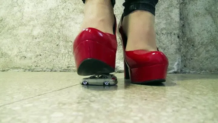 Toy car under my red high heels